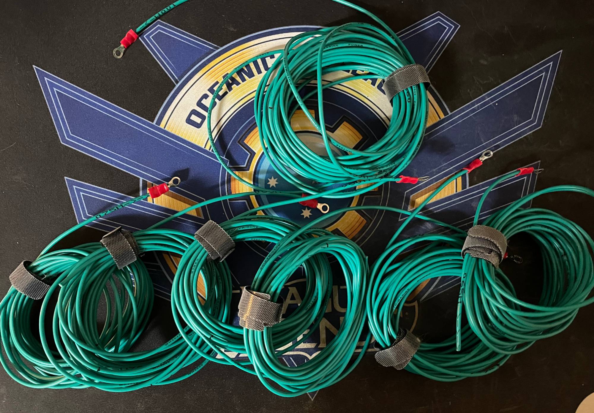 Seven coils of green PVC wire wound in a loop.